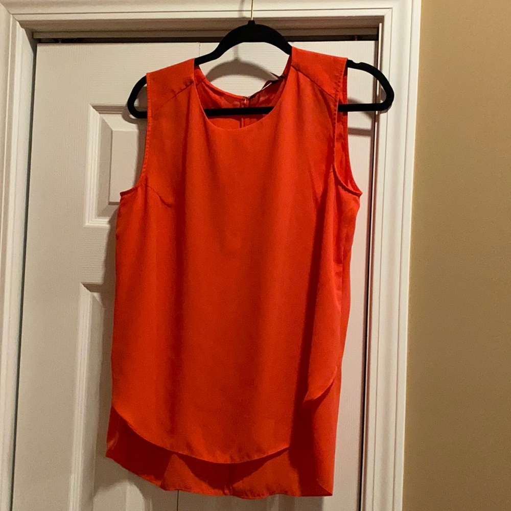 Sleeveless blouse dressy great for work  layered look great with a jacket